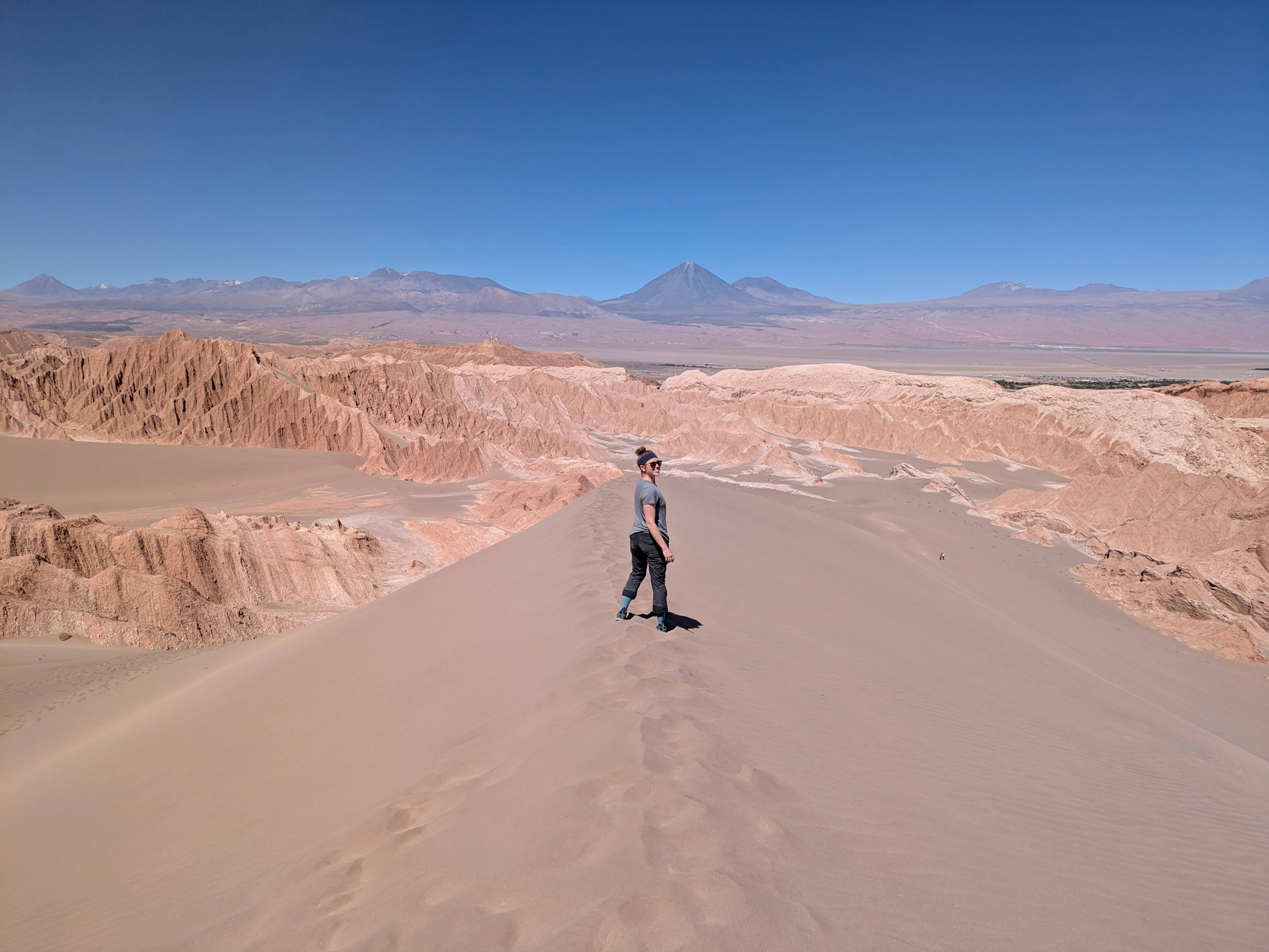 Stephanie on sand dunes in the Chilean Atacama desert