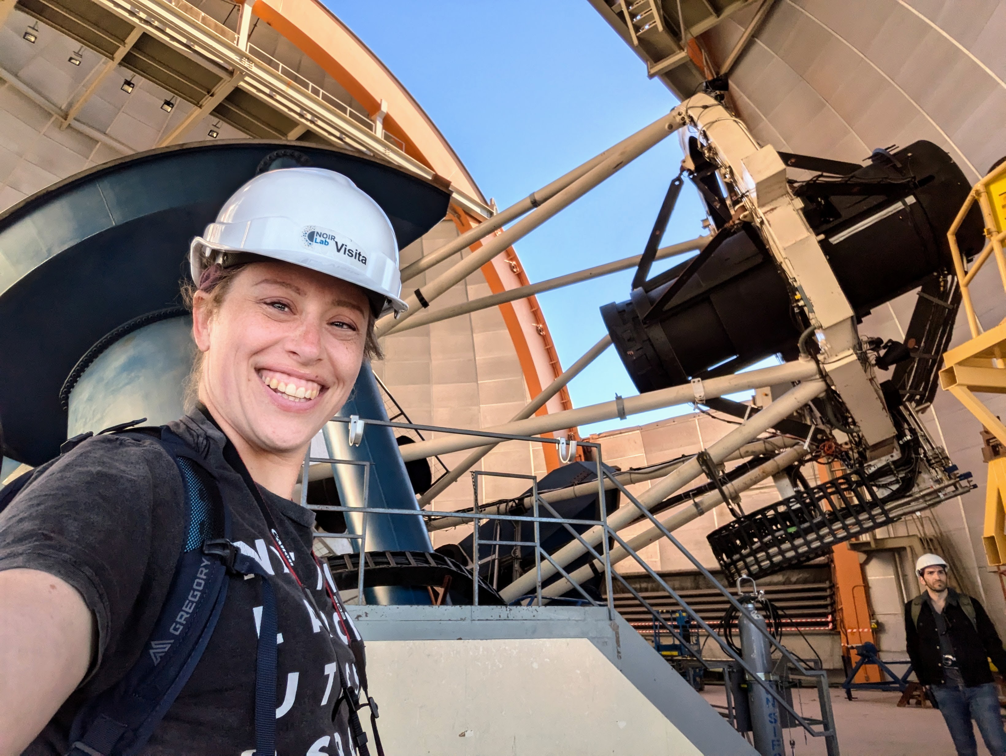 Stephanie with the 4-meter Blanco telescope and large Dark Energy Camerax